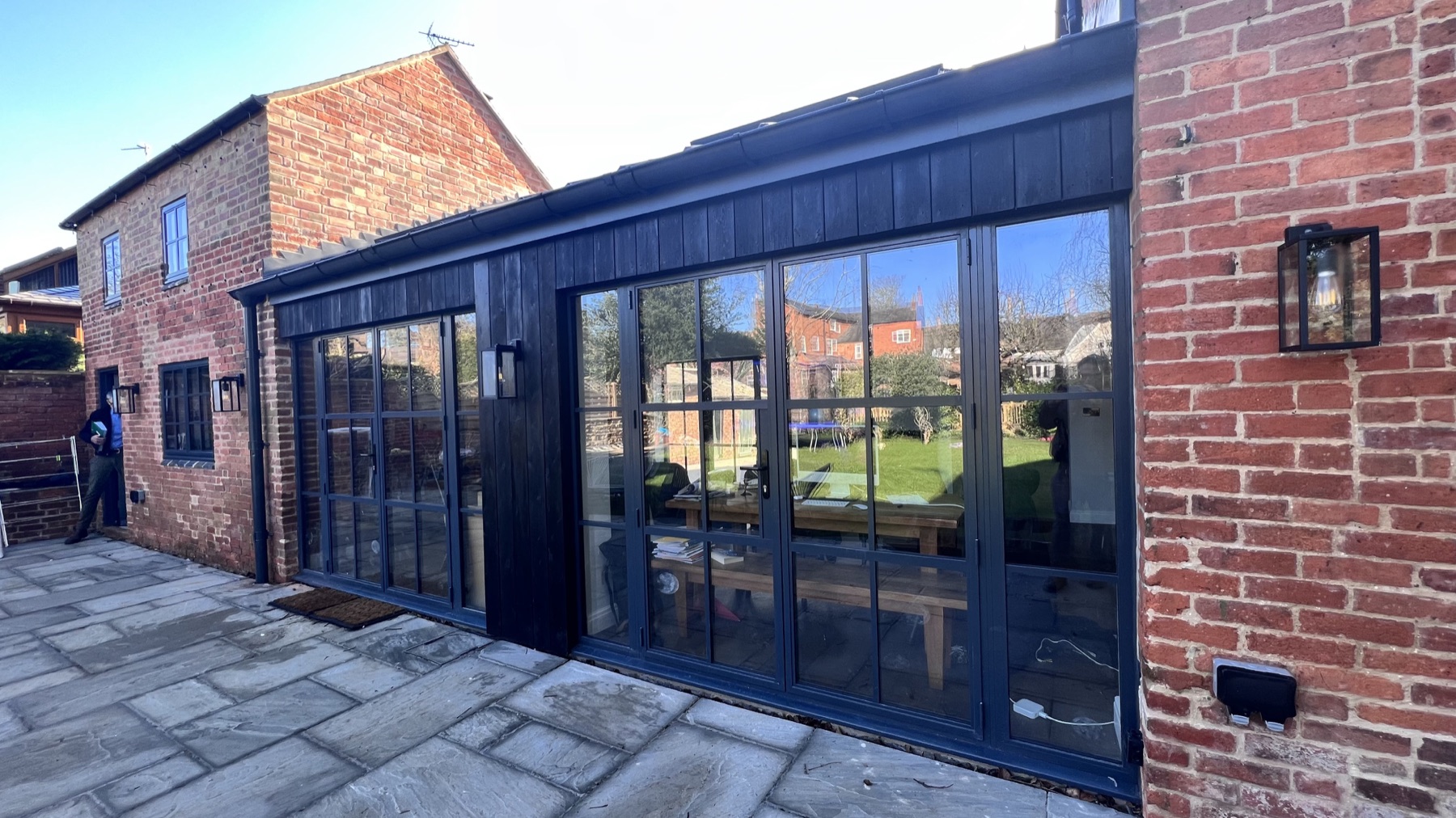 Courtyard elevation of Eastgate House with dark timber cladding and steel-framed glazing