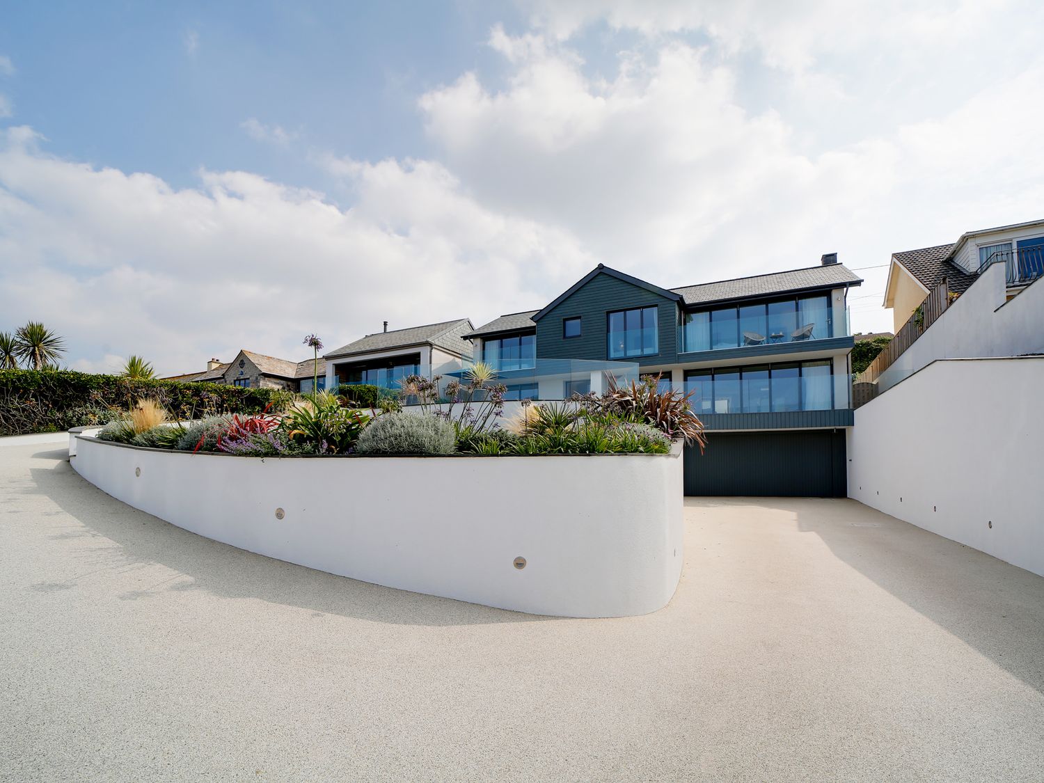 Landscaped approach and integrated basement garage at MegIzzy