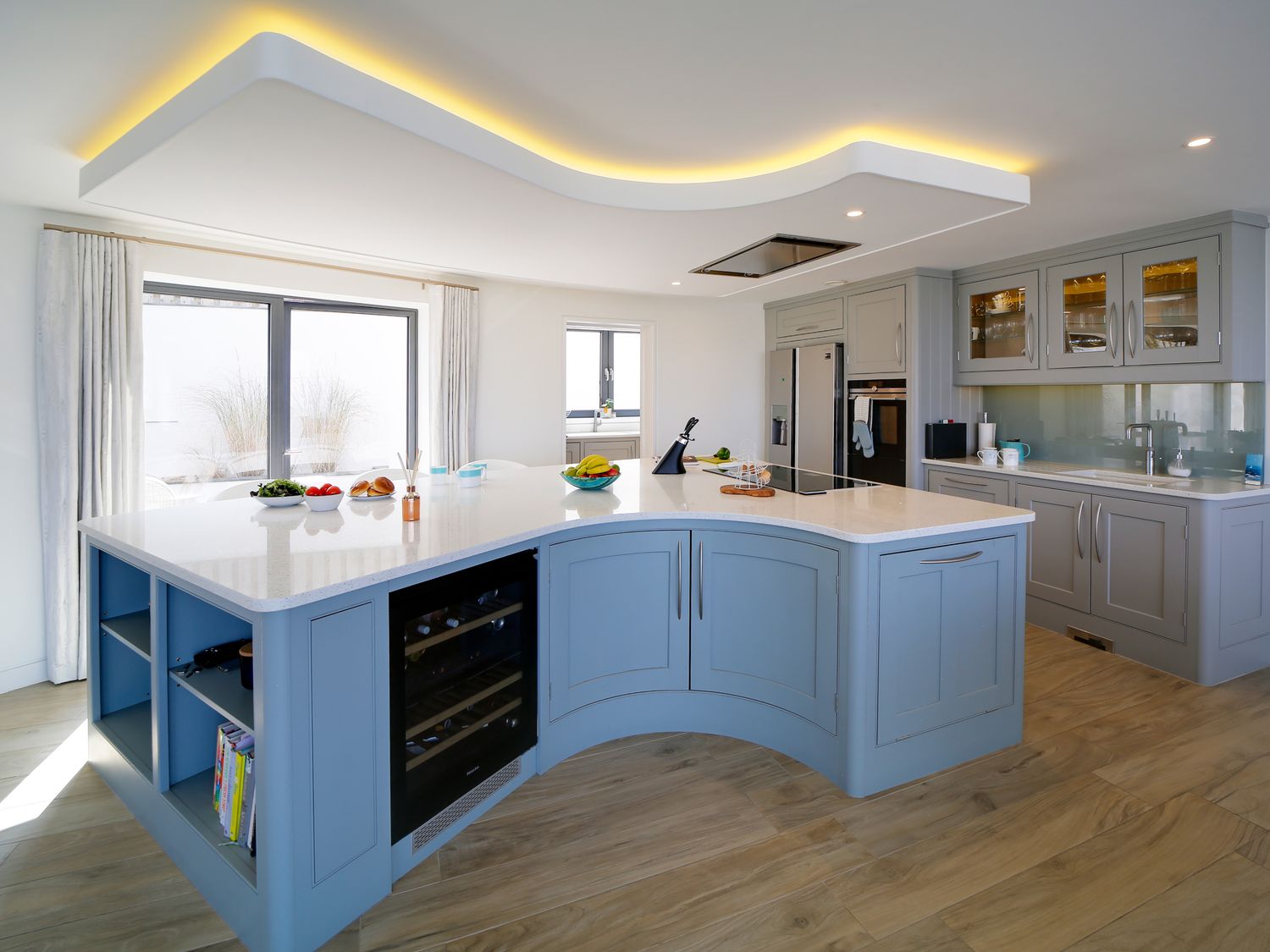 Bespoke curved kitchen island in the MegIzzy coastal home