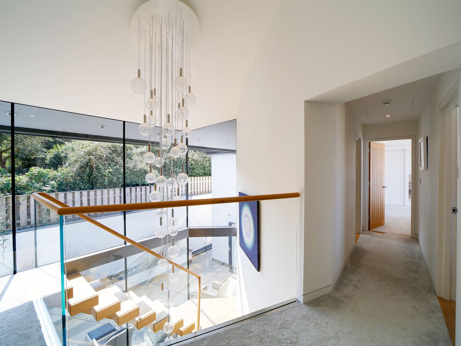 Light-filled upper landing overlooking the double-height stair space